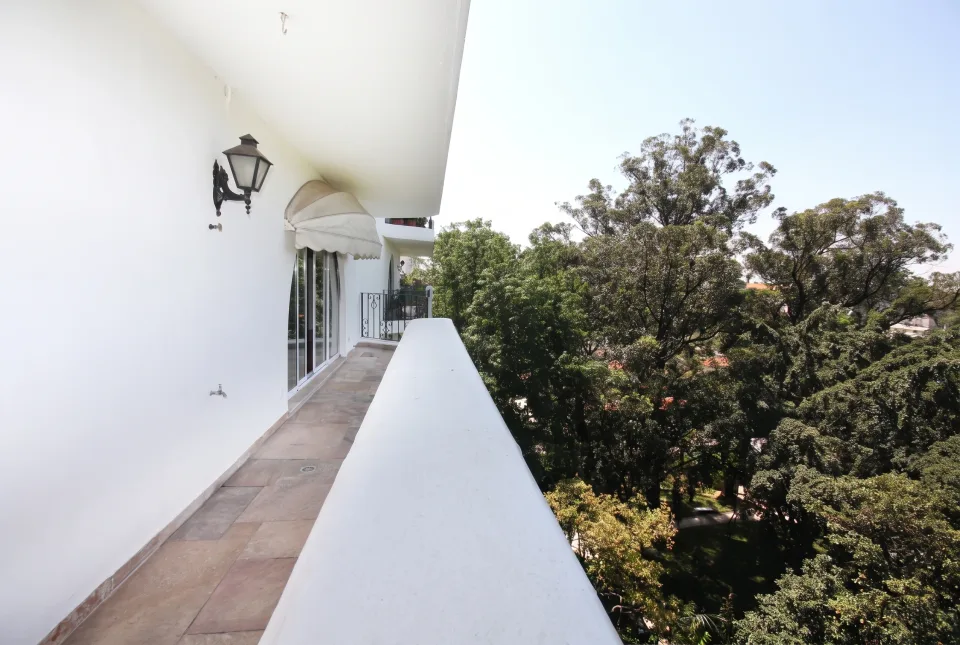 Apartment balcony overlooking trees