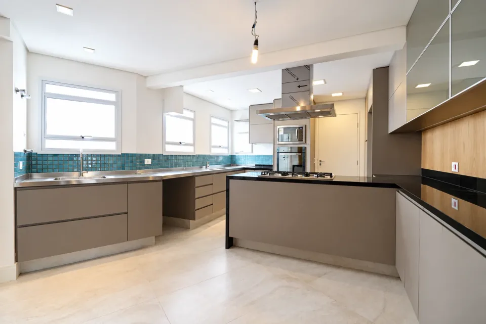 Unfurnished apartment kitchen with fitted cabinets